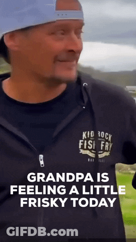 A Man Wearing A Black Shirt That Says Kid Rock Fish Fry On It GIF