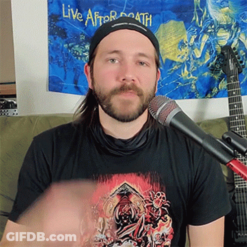A Man Wearing A Black Shirt That Says Live After Death On It GIF