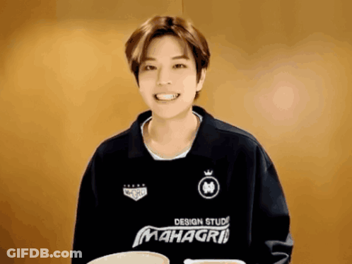 A Man Wearing A Black Shirt That Says Mahagri GIF