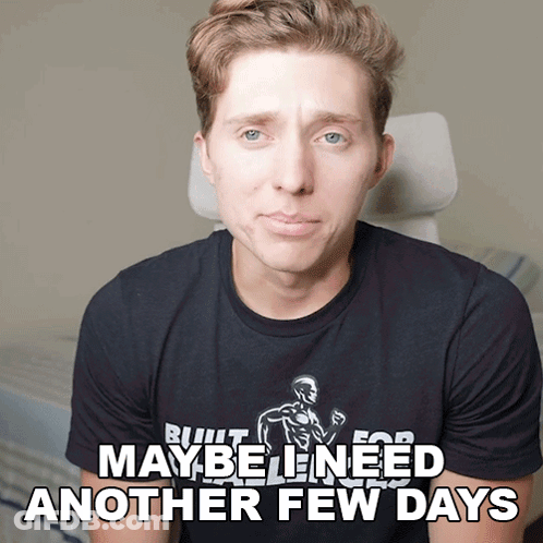 A Man Wearing A Black Shirt That Says " Maybe Need Another Few Days " GIF