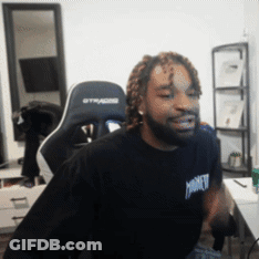 A Man Wearing A Black Shirt That Says Monkey Is Sitting In A Gaming Chair GIF