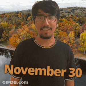 A Man Wearing A Black Shirt That Says November 30 On It GIF