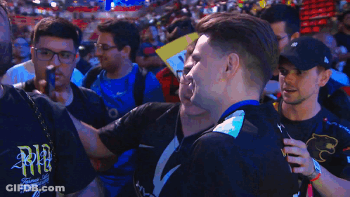 A Man Wearing A Black Shirt That Says Nvidia Smiles In Front Of A Crowd GIF