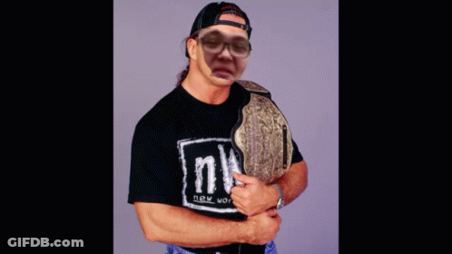 A Man Wearing A Black Shirt That Says Nwo GIF