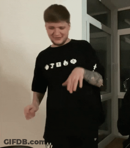 A Man Wearing A Black Shirt That Says ' Otoko ' On It Is Dancing GIF
