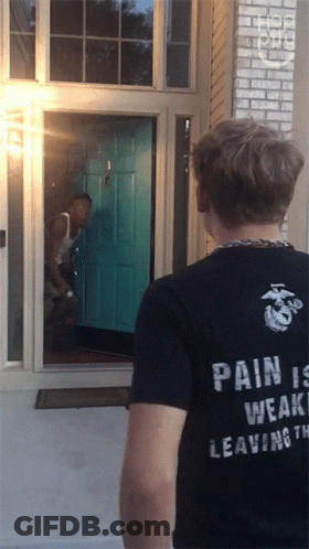 A Man Wearing A Black Shirt That Says " Pain Is Weak Leaving " GIF