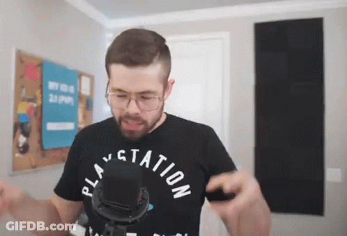A Man Wearing A Black Shirt That Says Play Station GIF