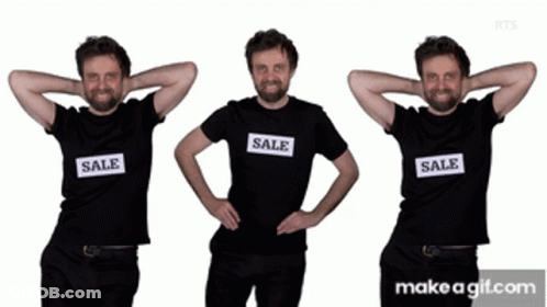 A Man Wearing A Black Shirt That Says Sale On It GIF