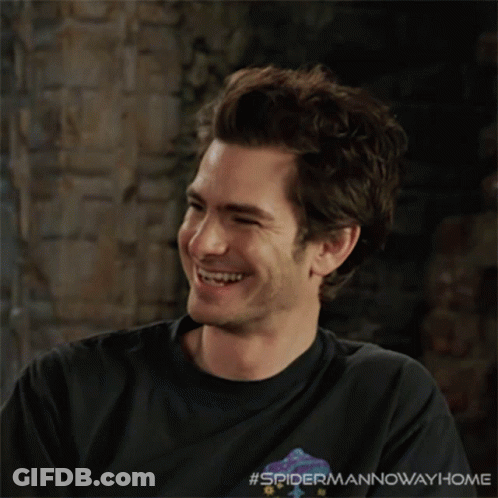 A Man Wearing A Black Shirt That Says #Spidermannowwayhome GIF