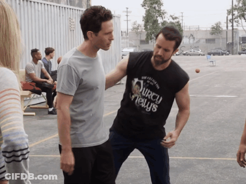 A Man Wearing A Black Shirt That Says ' Squirrel News ' GIF