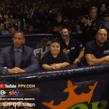 A Man Wearing A Black Shirt That Says " The " On It GIF