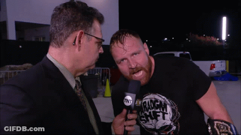 A Man Wearing A Black Shirt That Says Tnt On It GIF