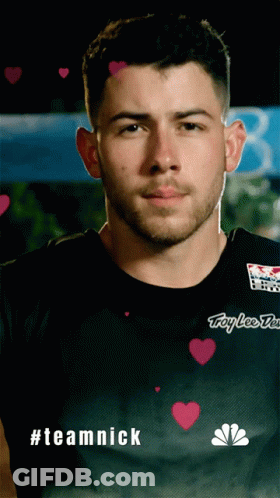 A Man Wearing A Black Shirt That Says Troy Lee Designs On It GIF