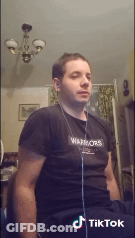 A Man Wearing A Black Shirt That Says Warriors On The Front GIF