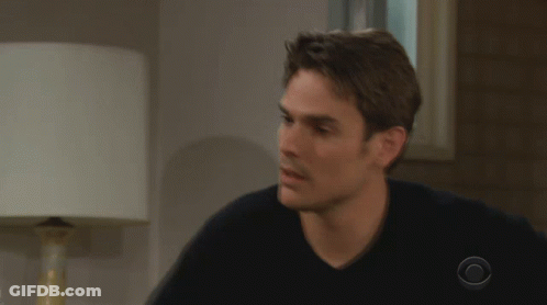 A Man Wearing A Black Shirt With A Cbs Logo On His Sleeve GIF