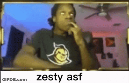 A Man Wearing A Black Shirt With A Devil On It Is Smoking A Cigarette In Front Of A Mirror . GIF