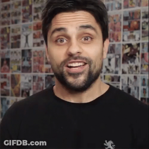 A Man Wearing A Black Shirt With A Lion On It GIF