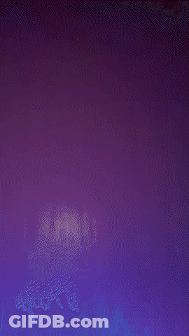 A Man Wearing A Black Shirt With A Panther On It Stands In Front Of A White Wall GIF