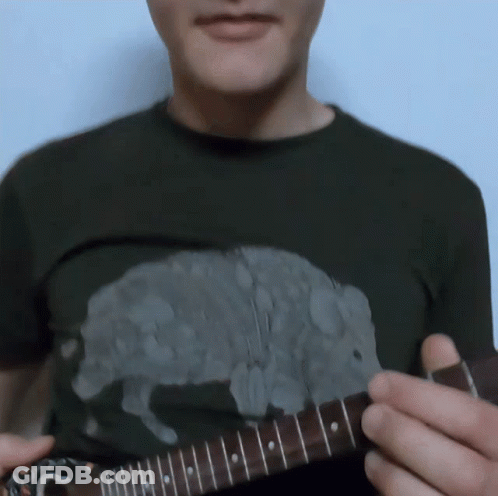Man Playing Guitar With Pig Shirt GIF