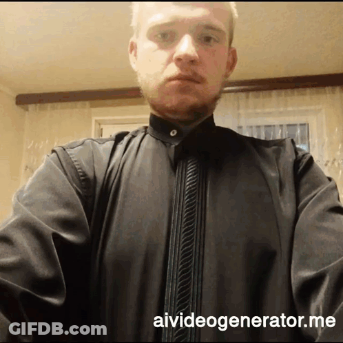A Man Wearing A Black Shirt With Aivideogenerator.me Written On The Bottom GIF