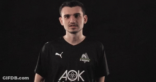 A Man Wearing A Black Shirt With Aok Written On It GIF