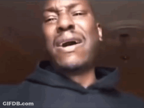 A Man Wearing A Black Shirt With Pink Letters That Says Shayla On It GIF