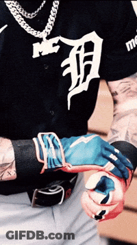 A Man Wearing A Black Shirt With The Letter D On The Front GIF
