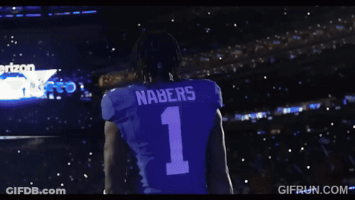 A Man Wearing A Black Shirt With The Number 2 On It GIF