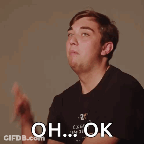 A Man Wearing A Black Shirt With The Number 20 On It Is Making A Funny Face And Says Oh Ok GIF