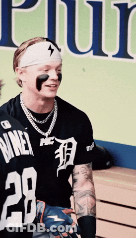 A Man Wearing A Black Shirt With The Number 28 GIF