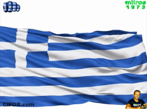A Man Wearing A Black Shirt With The Word Boy On It Stands In Front Of A Blue And White Flag GIF