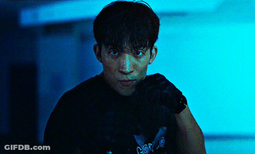 A Man Wearing A Black Shirt With The Word Force On It Looks At The Camera GIF