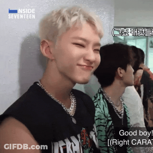 A Man Wearing A Black Shirt With The Word Inside Seventeen On It GIF