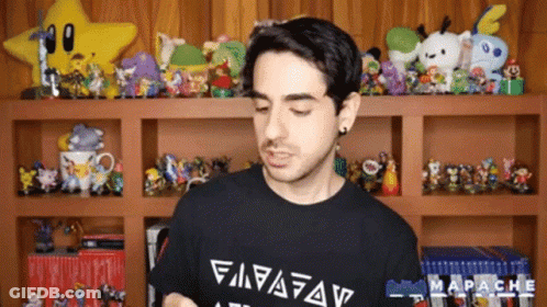 A Man Wearing A Black Shirt With The Word Mapache On The Front GIF