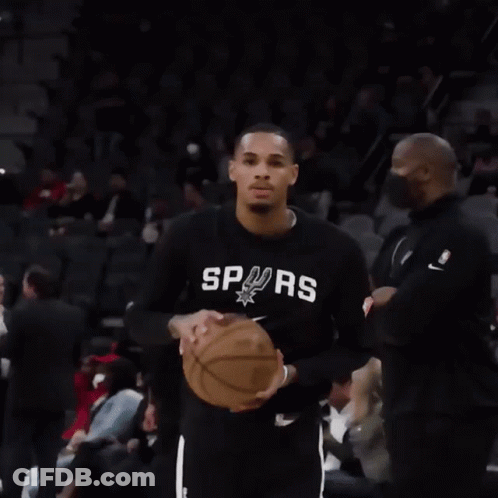 A Man Wearing A Black Shirt With The Word Spurs On It Is Holding A Basketball GIF