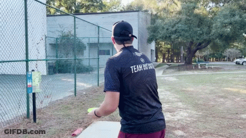 A Man Wearing A Black Shirt With The Word Team On The Back GIF