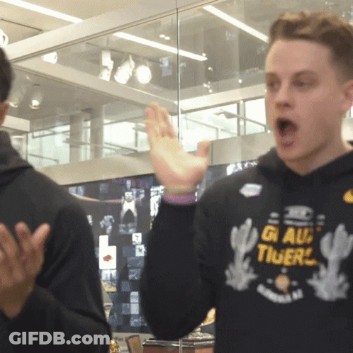 A Man Wearing A Black Sweatshirt That Says Gi Au Tigers GIF