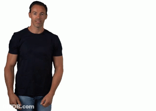 A Man Wearing A Black T-Shirt And Blue Jeans Is Smiling GIF