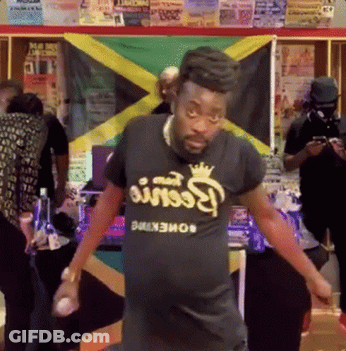 A Man Wearing A Black T-Shirt That Says Reese 'S Peanut Butter GIF