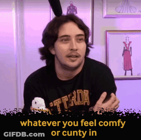 A Man Wearing A Black T-Shirt That Says ' Whatever You Feel Comfy Or Cunty In ' GIF
