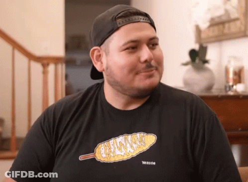 A Man Wearing A Black T-Shirt With A Picture Of Corn On The Cob On It GIF