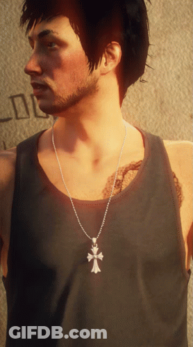 A Man Wearing A Black Tank Top And A Silver Cross Necklace GIF