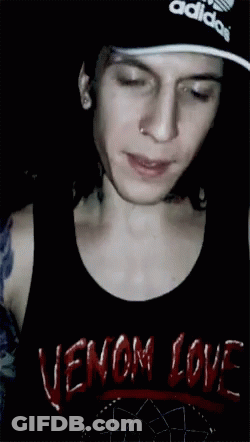 A Man Wearing A Black Tank Top That Says Venom Love On It GIF