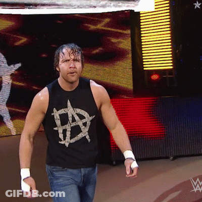 A Man Wearing A Black Tank Top With An Anarchy Symbol GIF