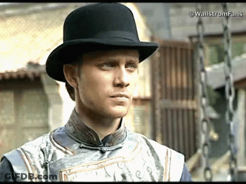 A Man Wearing A Black Top Hat And A Gray Shirt With The Words Wallstromfans Written On The Bottom GIF