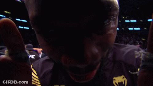 A Man Wearing A Black Ufc Shirt With Crypto.com On It GIF