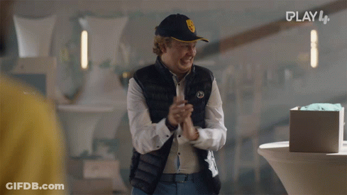 A Man Wearing A Black Vest And A Hat With The Word Play On The Bottom GIF