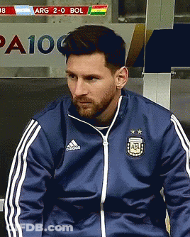 A Man Wearing A Blue Adidas Jacket Sits In A Locker Room GIF