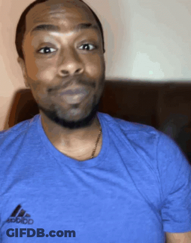 A Man Wearing A Blue Adidas T-Shirt Looks At The Camera GIF