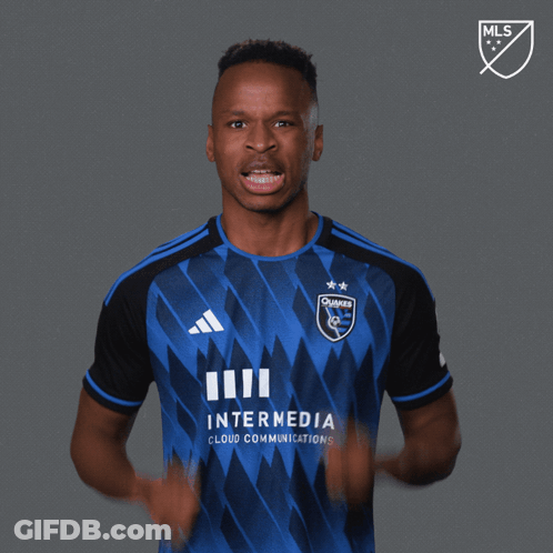 A Man Wearing A Blue And Black Jersey With The Words Let 'S Go On It GIF